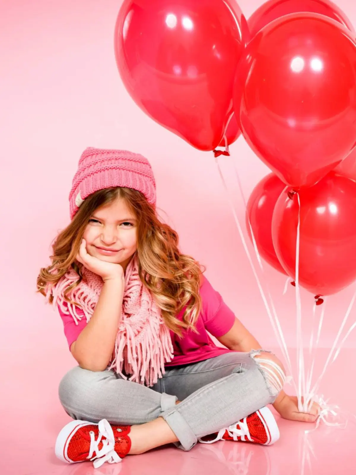 Girl holding balloons, photographed by Mobile Photographer